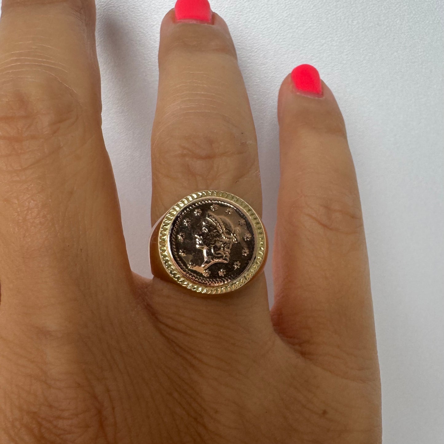 18K gold coin ring set with an authentic 22K gold coin at the center.