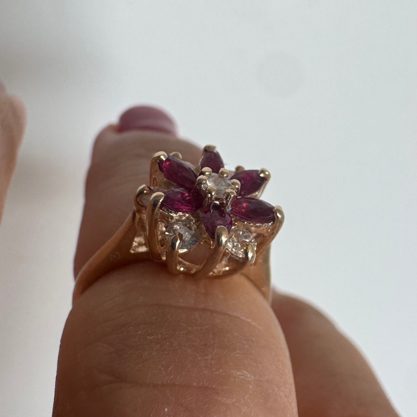 14K gold ring featuring a classic floral-inspired design set with marquise-cut Rubies & Diamonds.