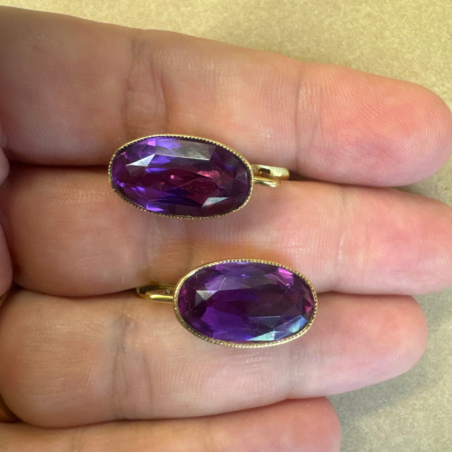 18K gold short drop earrings set with a deep oval-cut Amethyst