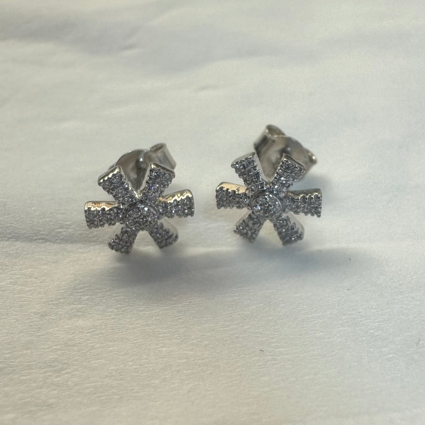 14K gold stud earrings set with Diamonds