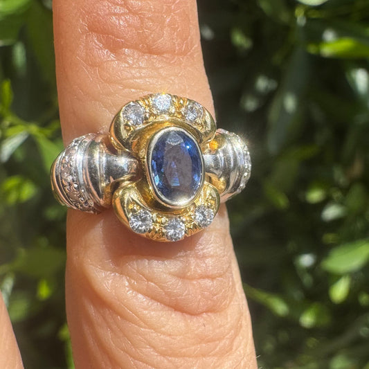 18K two-tone gold ring set with an oval Tanzanite & round brilliant diamonds