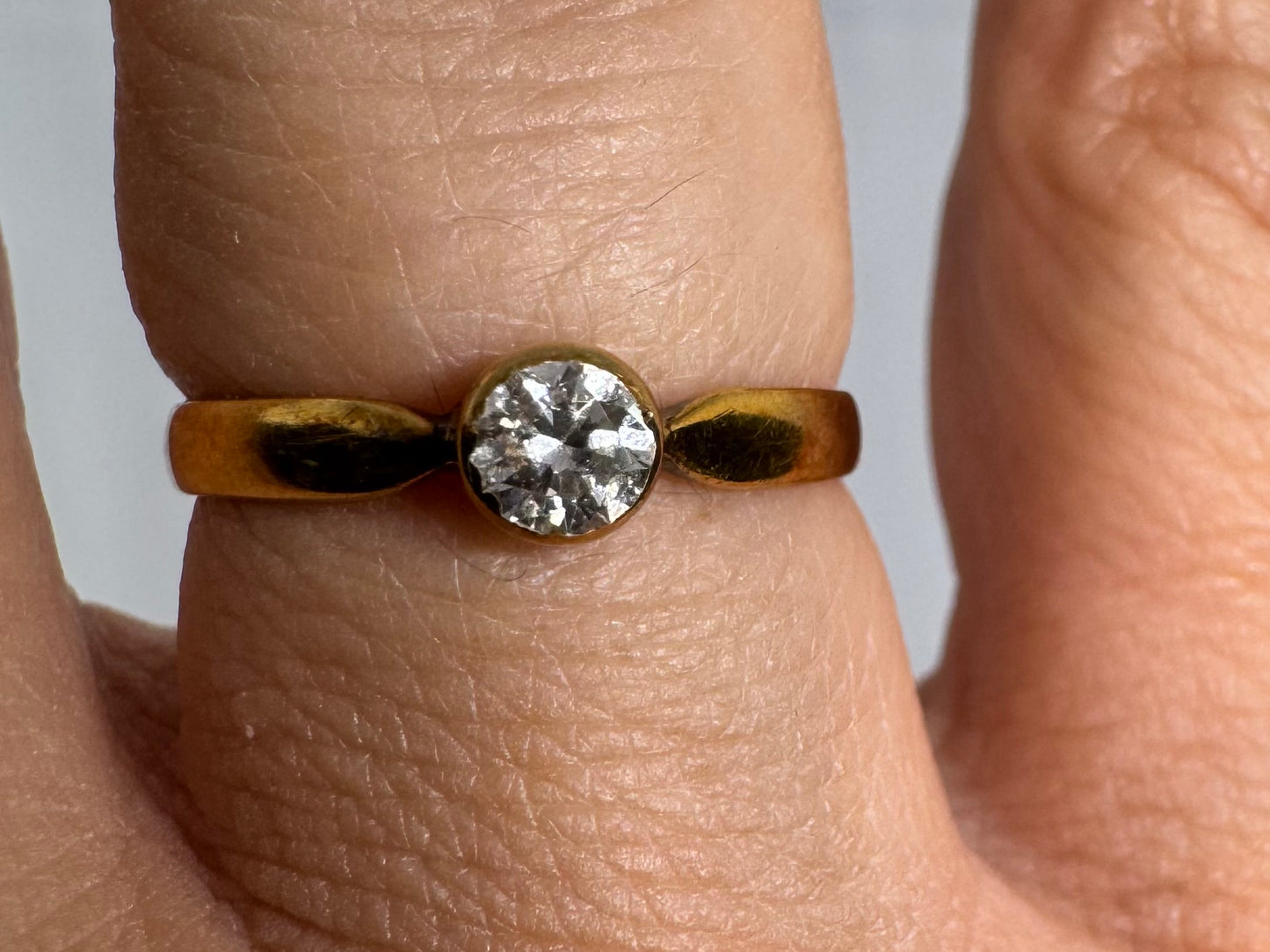 14K gold ring set with one center Diamond