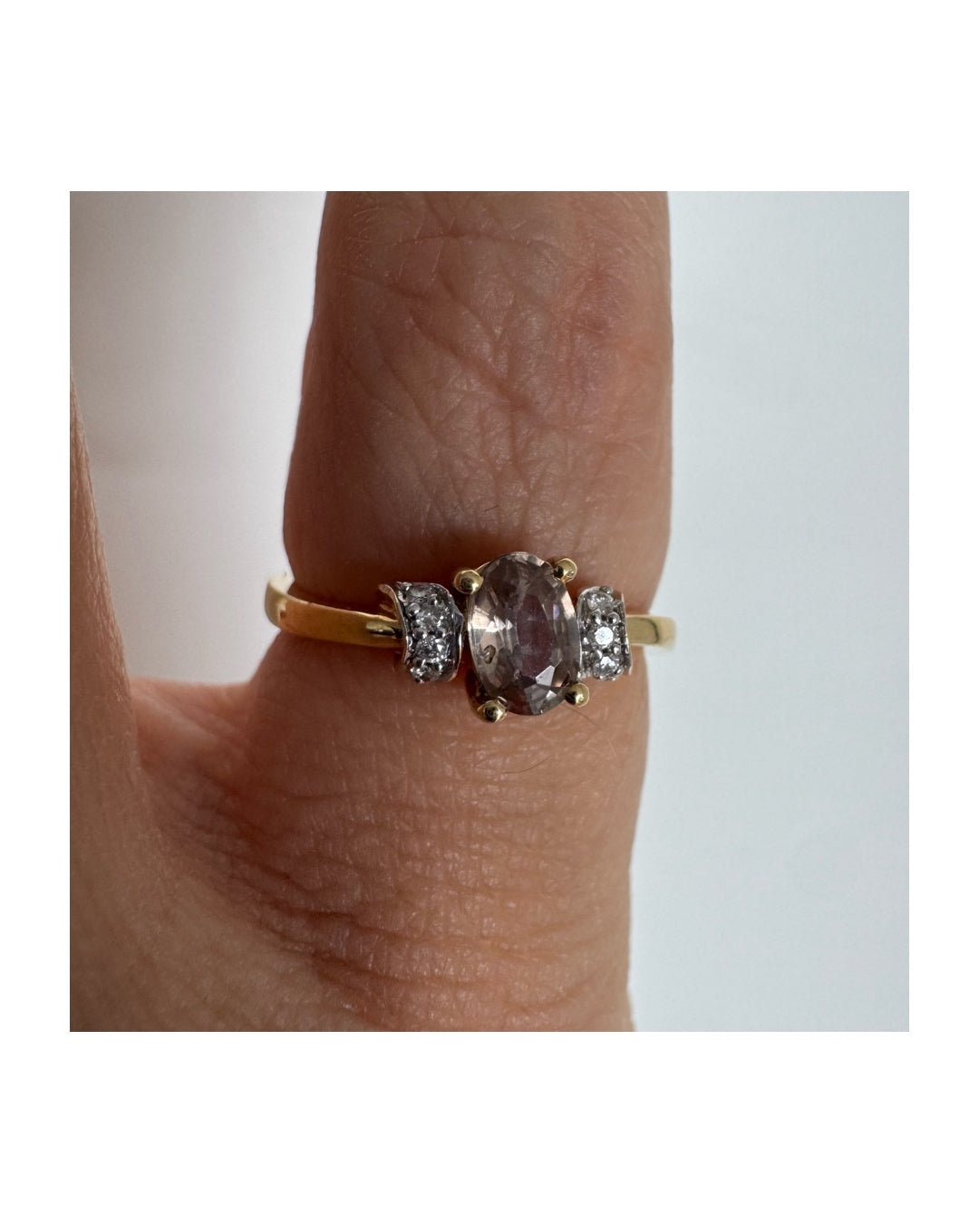 18K gold ring featuring a captivating oval Smoky Quartz & side Diamonds