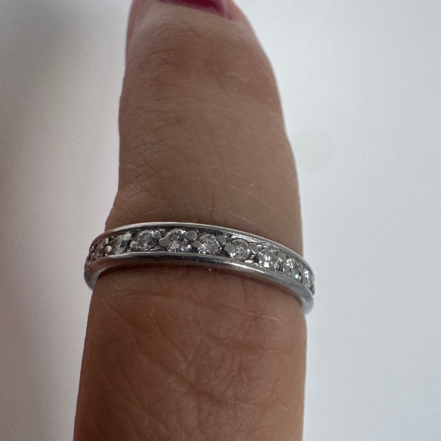 14K white gold eternity ring set with a row of sparkling Diamonds