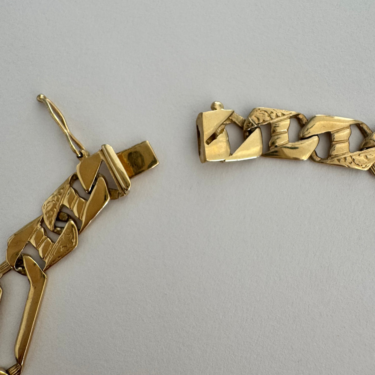 14K gold bracelet with a modern, distinctive link design