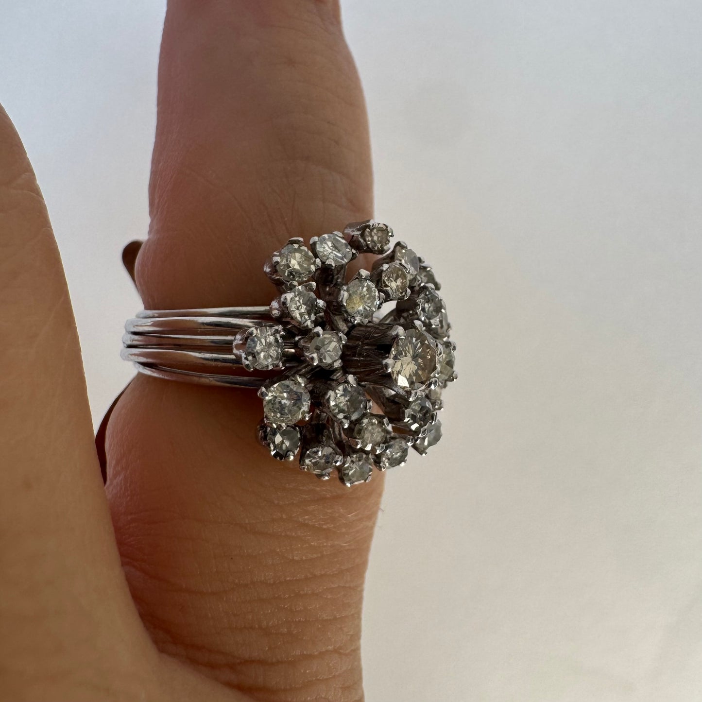 14K gold ring set with a cluster of sparkling Diamonds in a rich floral-inspired design.