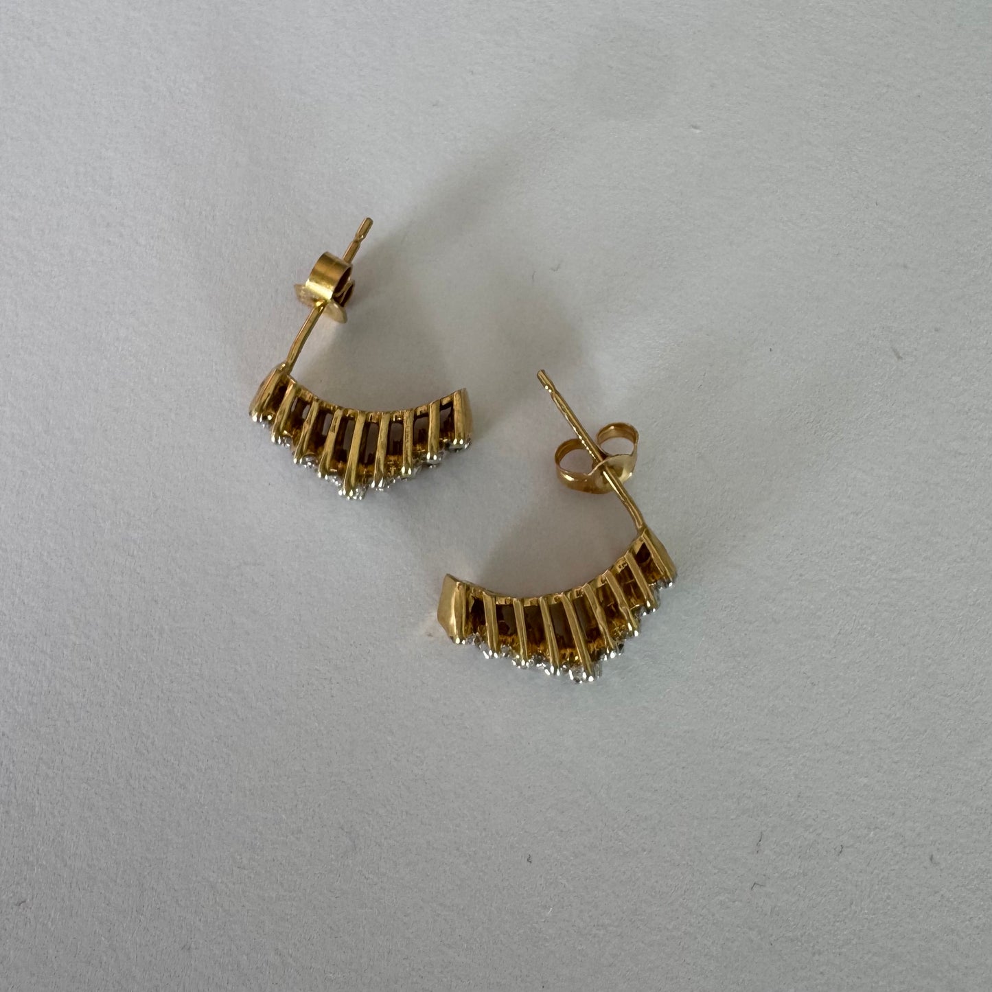 14K gold half-hoop earrings set with sparkling Diamonds in a dense pavé setting