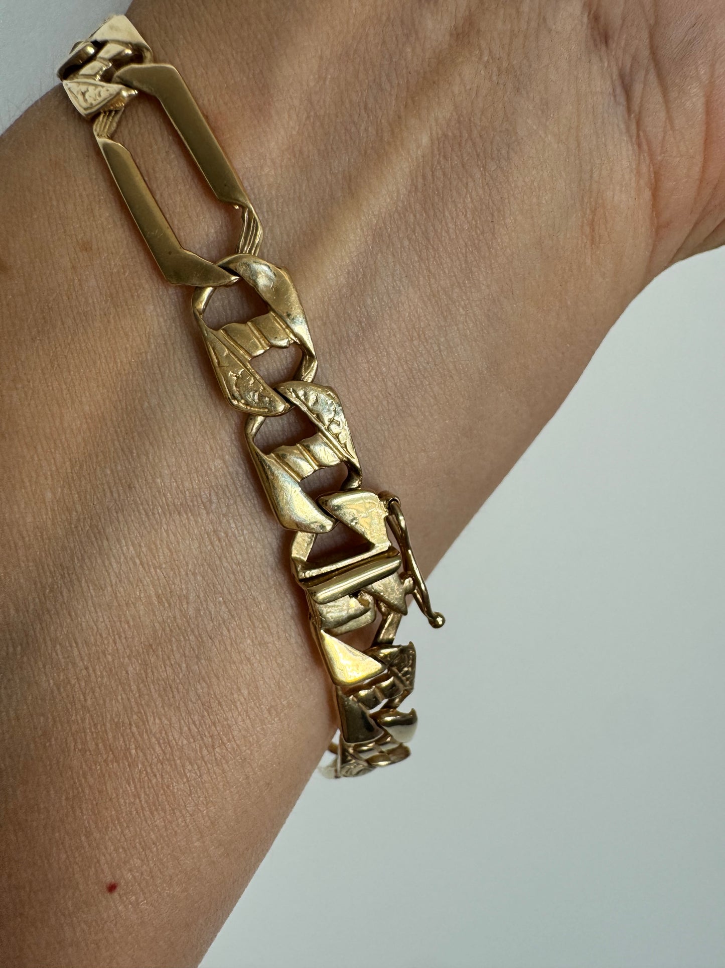 14K gold bracelet with a modern, distinctive link design