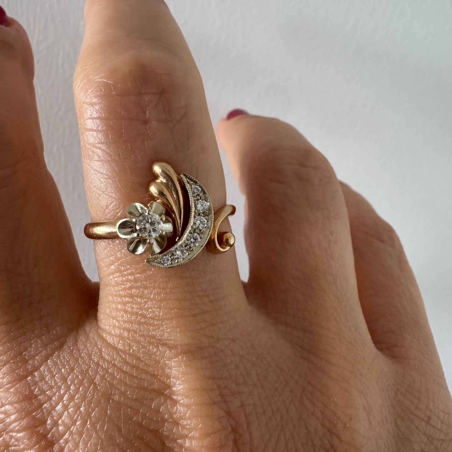 14K gold ring with a delicate moon and star motif set with Diamonds