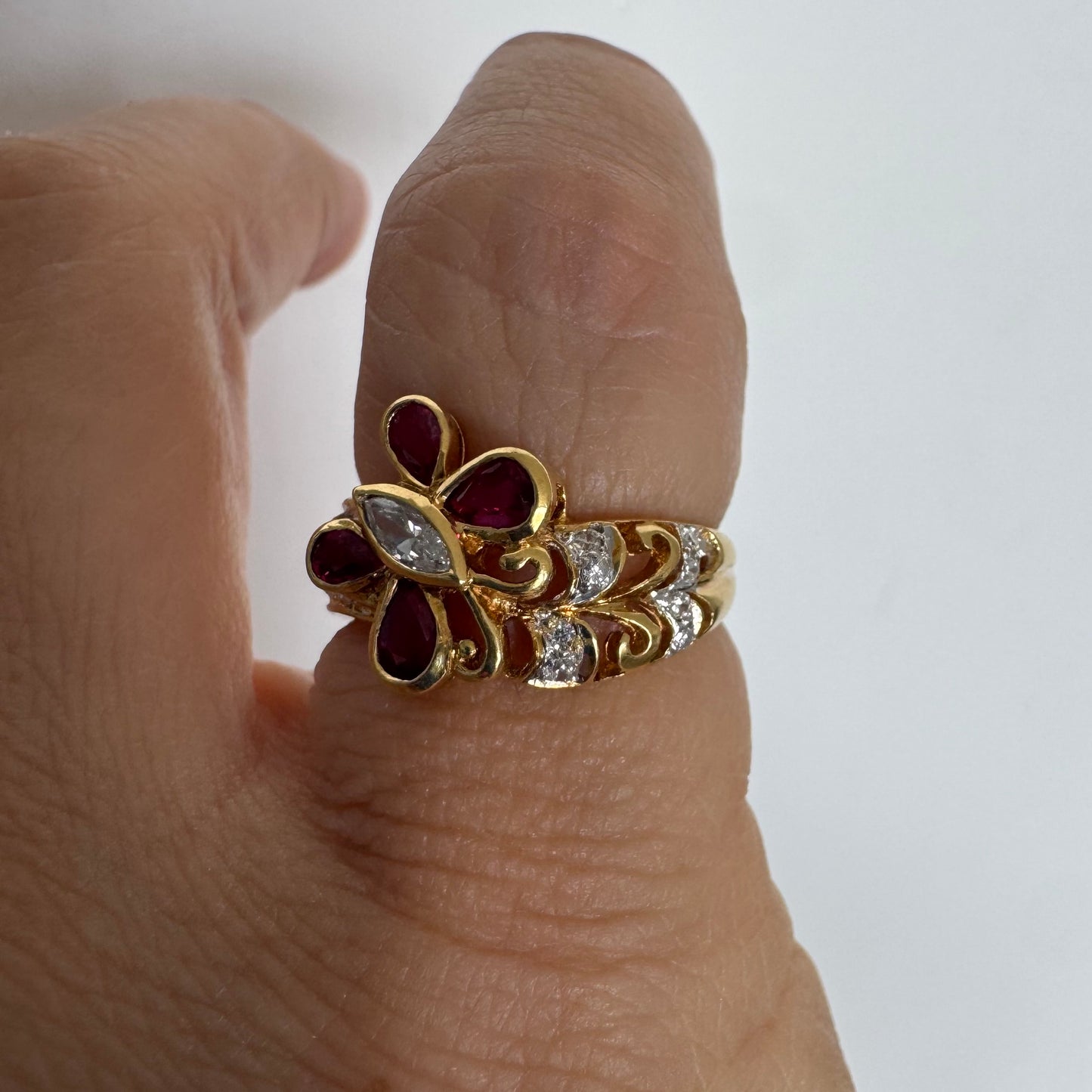 18K gold butterfly ring set with pear-cut Rubies & a marquise-cut Diamond at its center