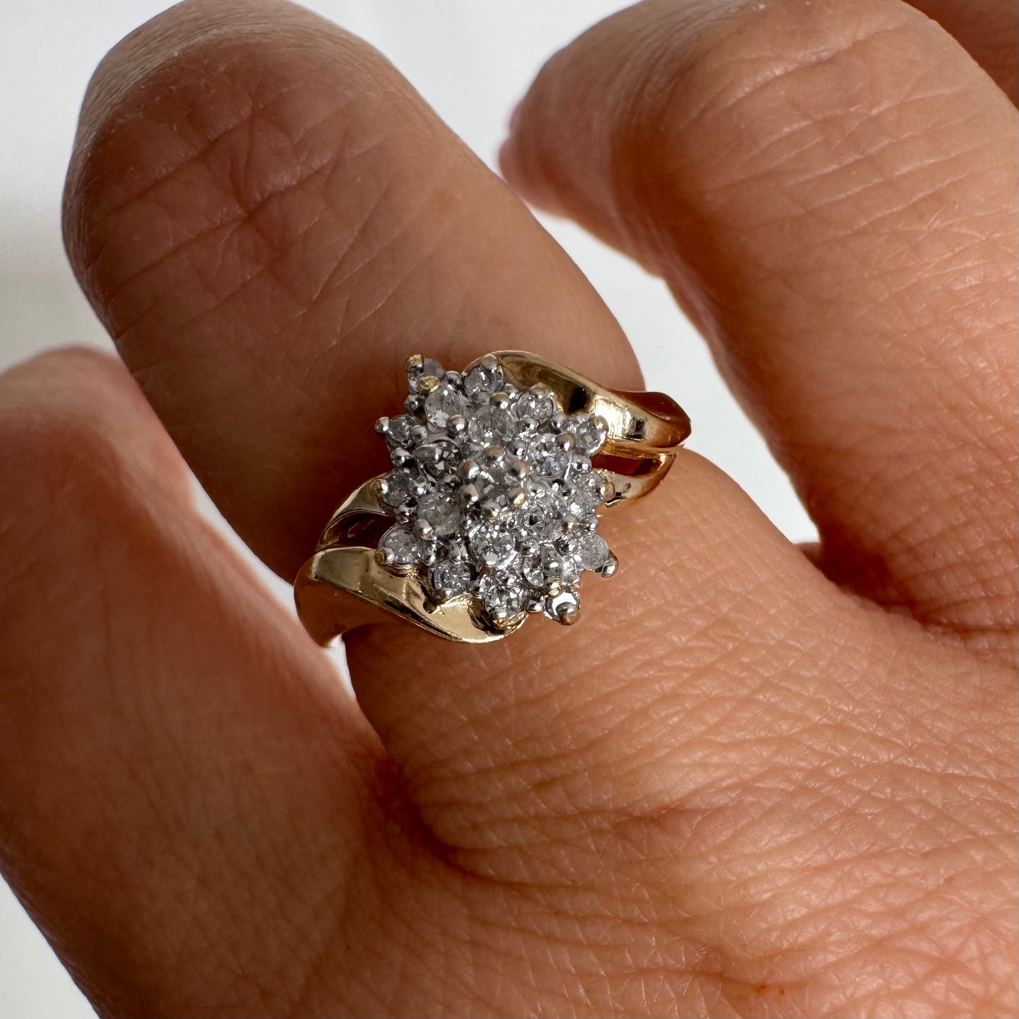10K gold ring set with Diamonds, featuring a classic design with soft, flowing curves.