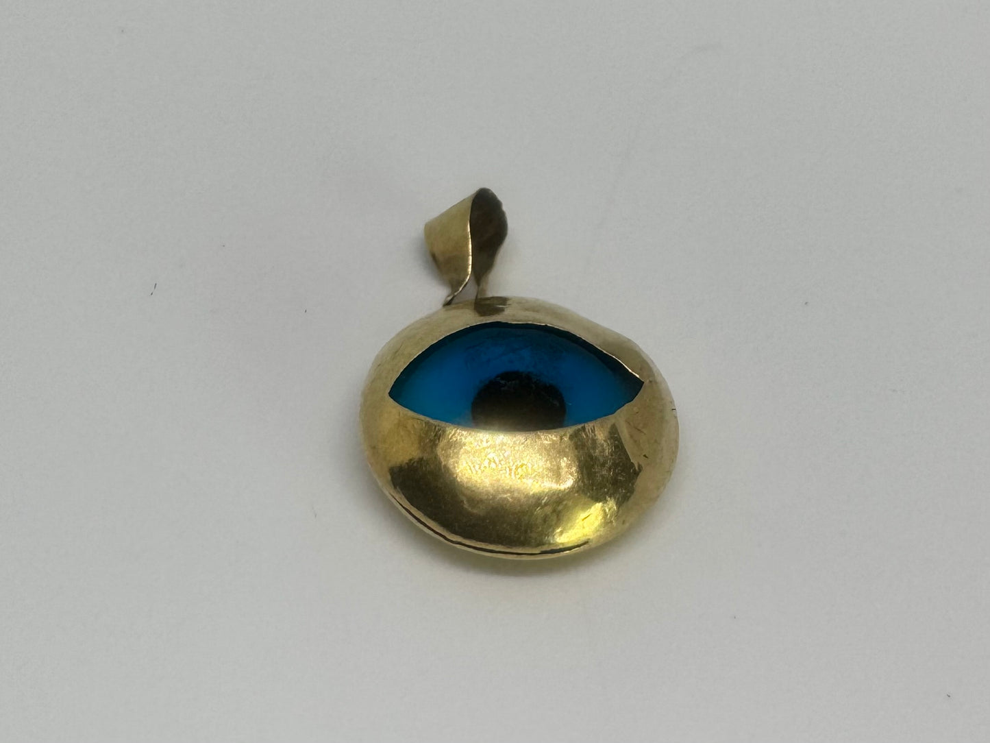 14K gold pendant set with “evil eye”