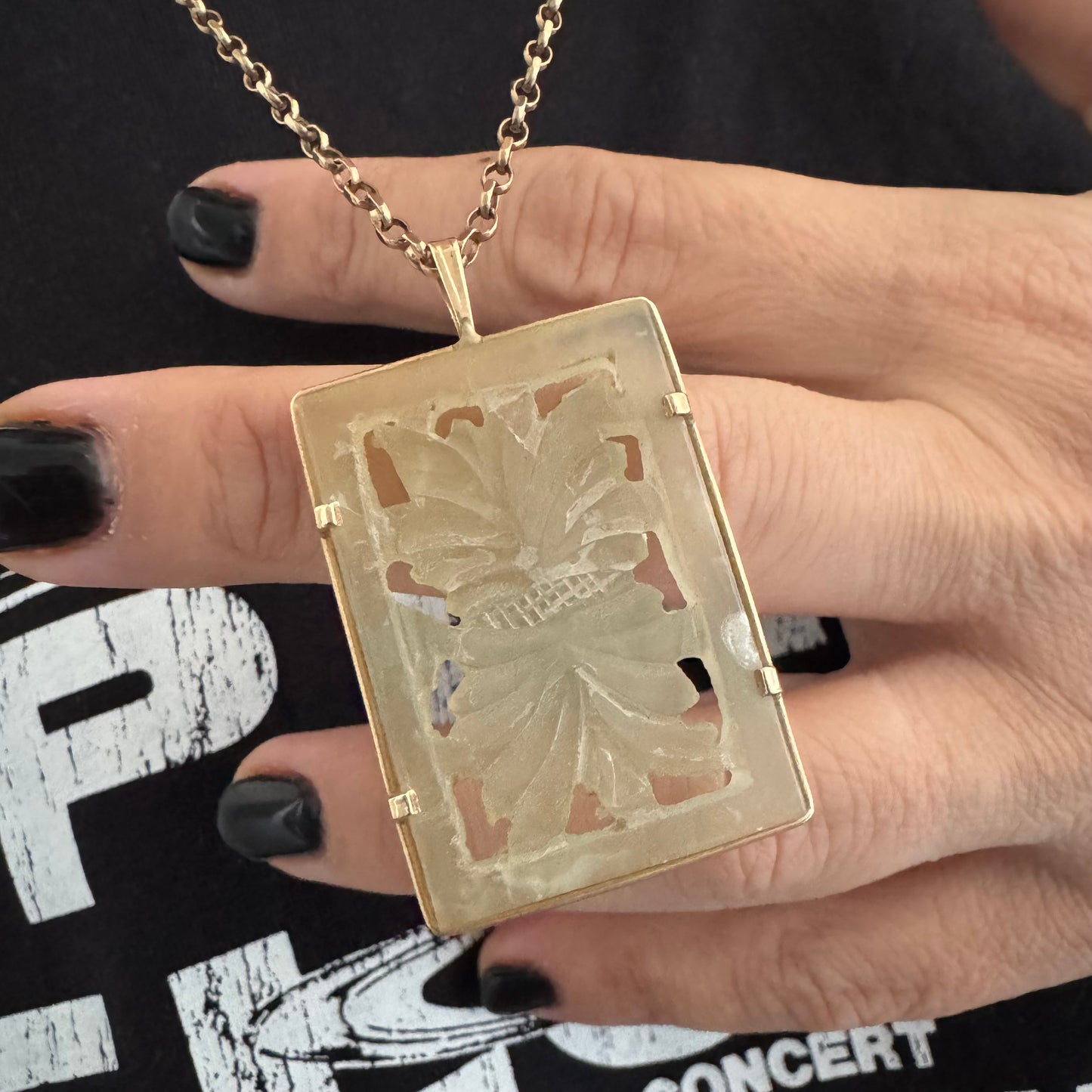 14K gold rectangular pendant set with a hand-carved milky Jade stone