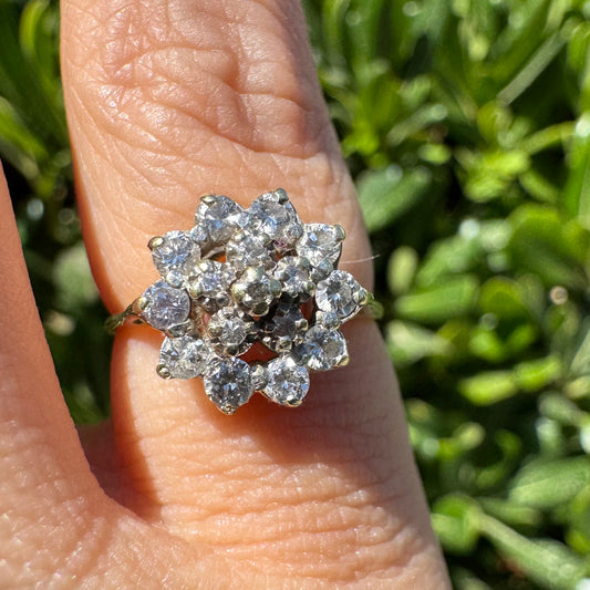 14K gold floral ring set with a dazzling double halo of sparkling Diamonds arranged in a blooming design