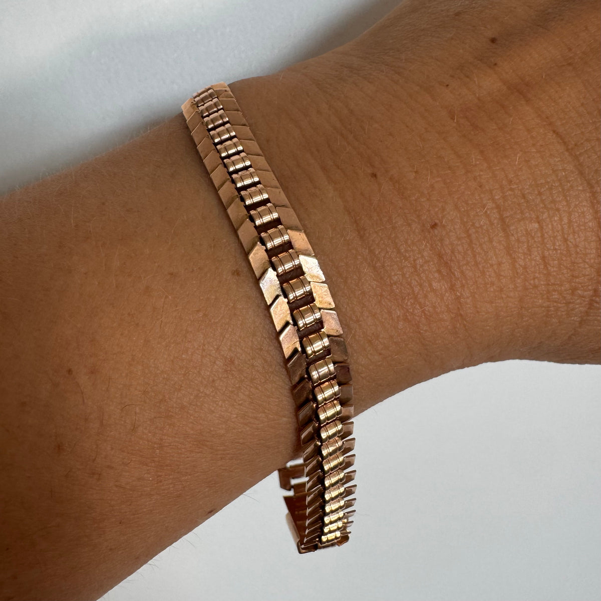 14K gold bracelet with a bold, flexible link design and a secure box clasp.