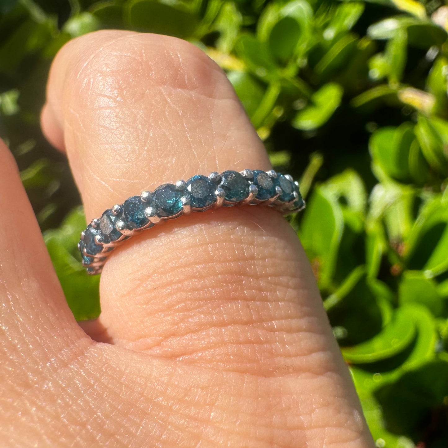 14K gold ring set with Blue Diamonds