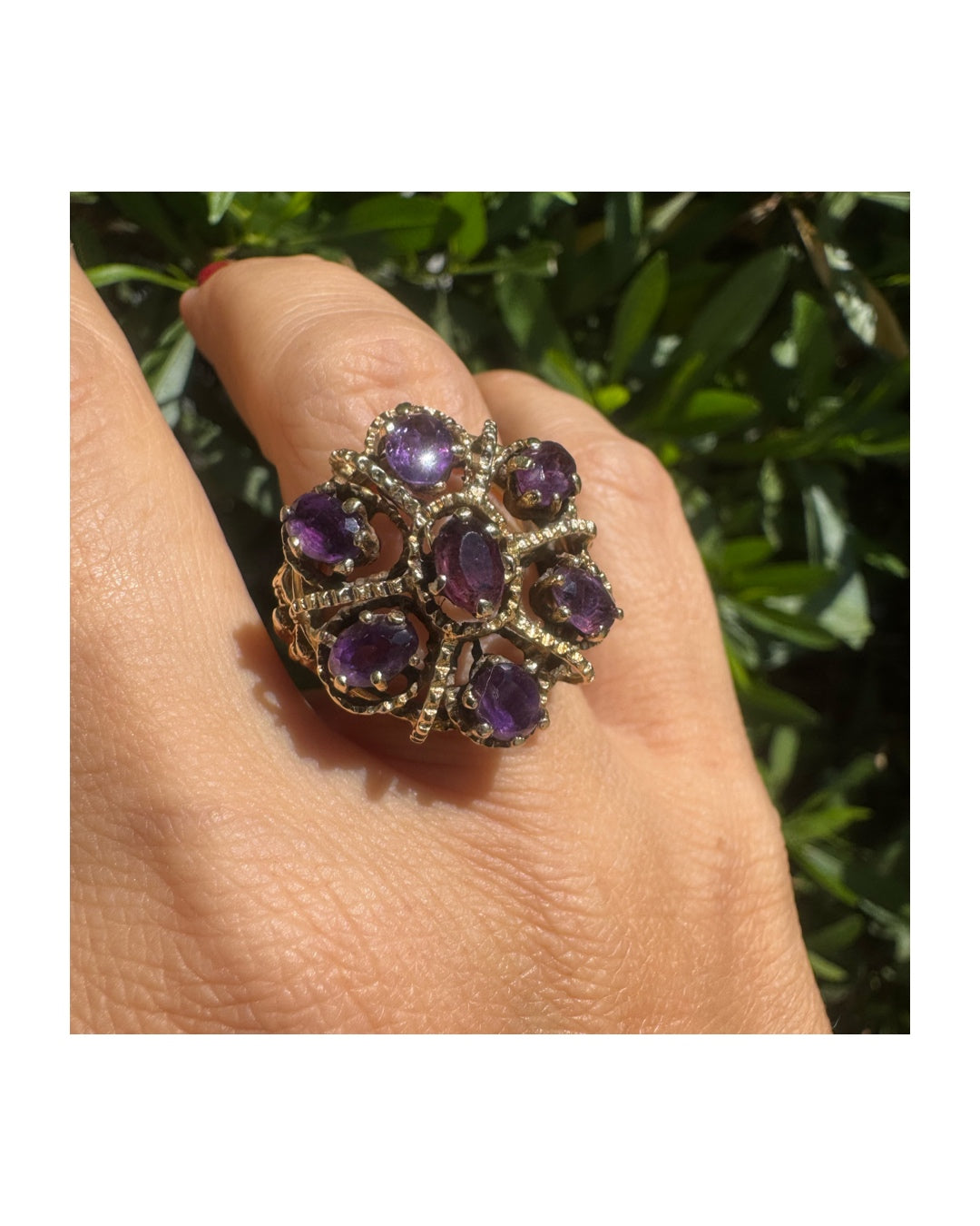 14K yellow gold cocktail ring set with a stunning cluster of Amethyst stones in marquise cuts.