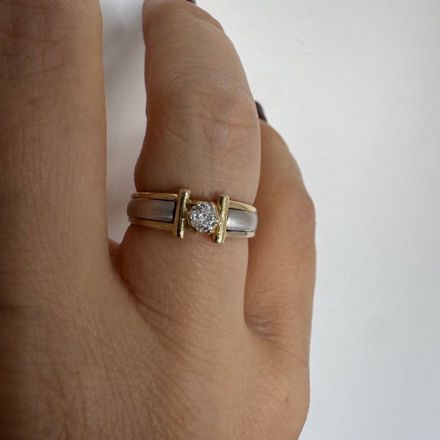 14K two-tone gold ring set with one center Diamond