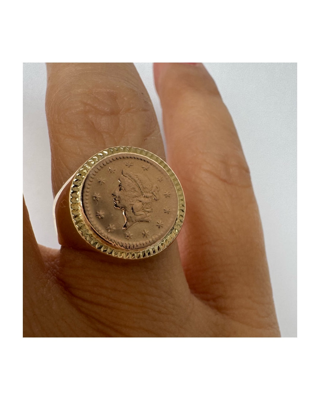 18K gold coin ring set with an authentic 22K gold coin at the center.