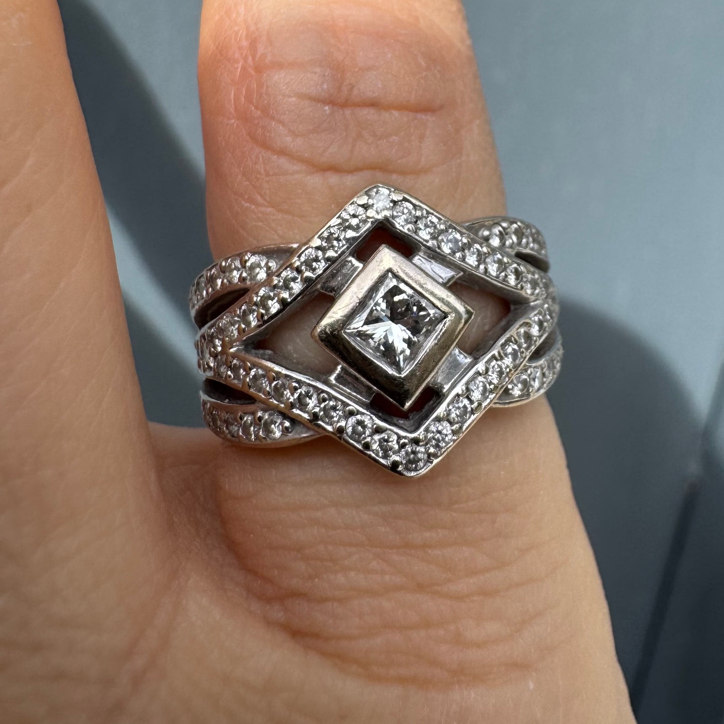 14K gold diamond ring featuring a luxurious geometric Art-Deco inspired design.