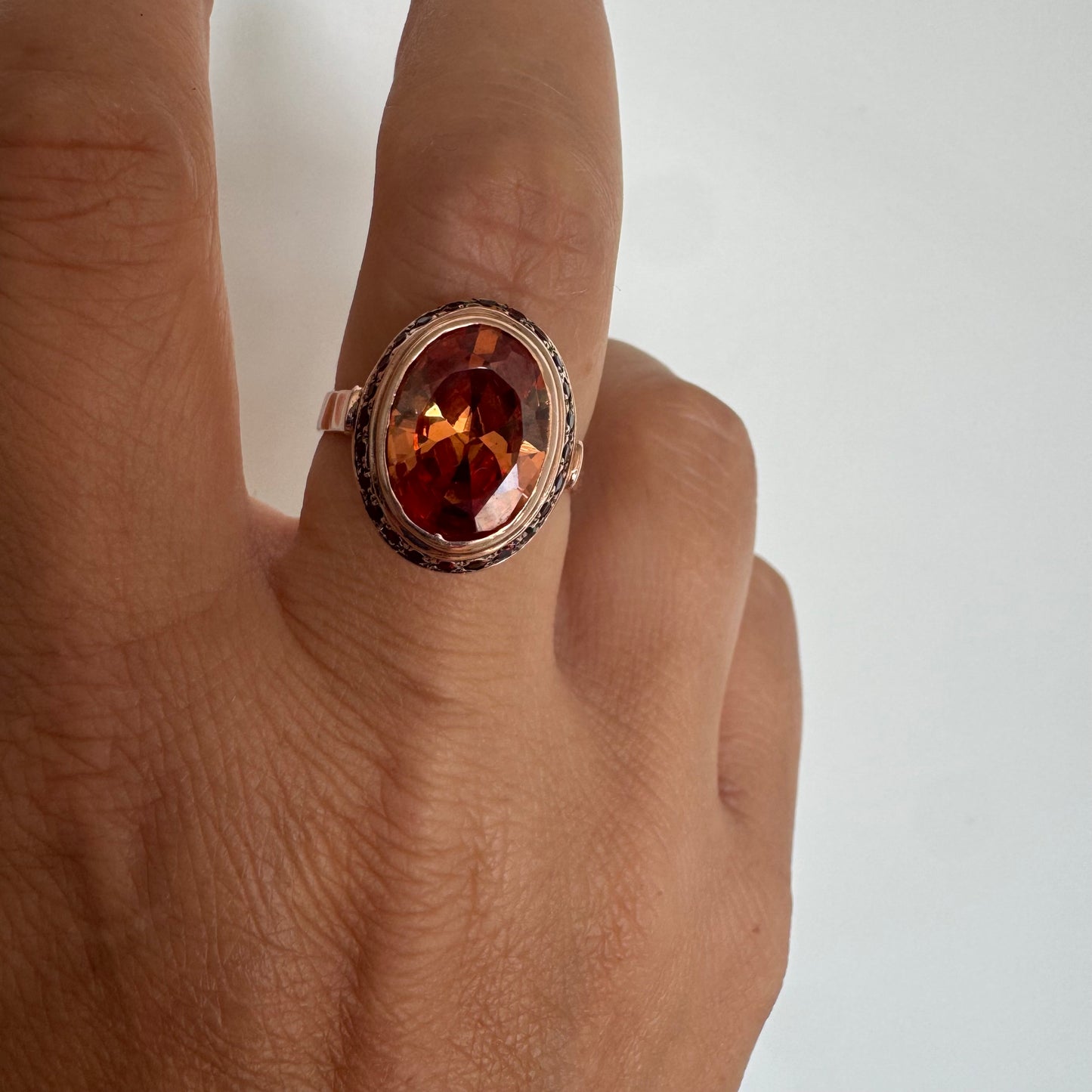 14K gold ring featuring a large cognac-toned Citrine, accented with delicate Ruby stones for a touch of rich color and contrast.