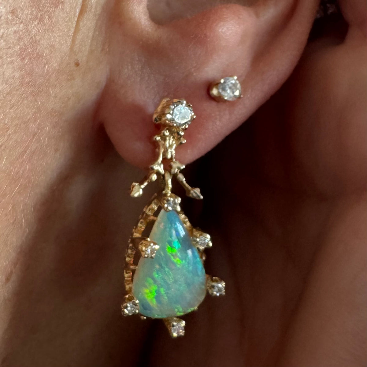14K gold drop earrings set with pear-shaped Opals and Diamonds.
