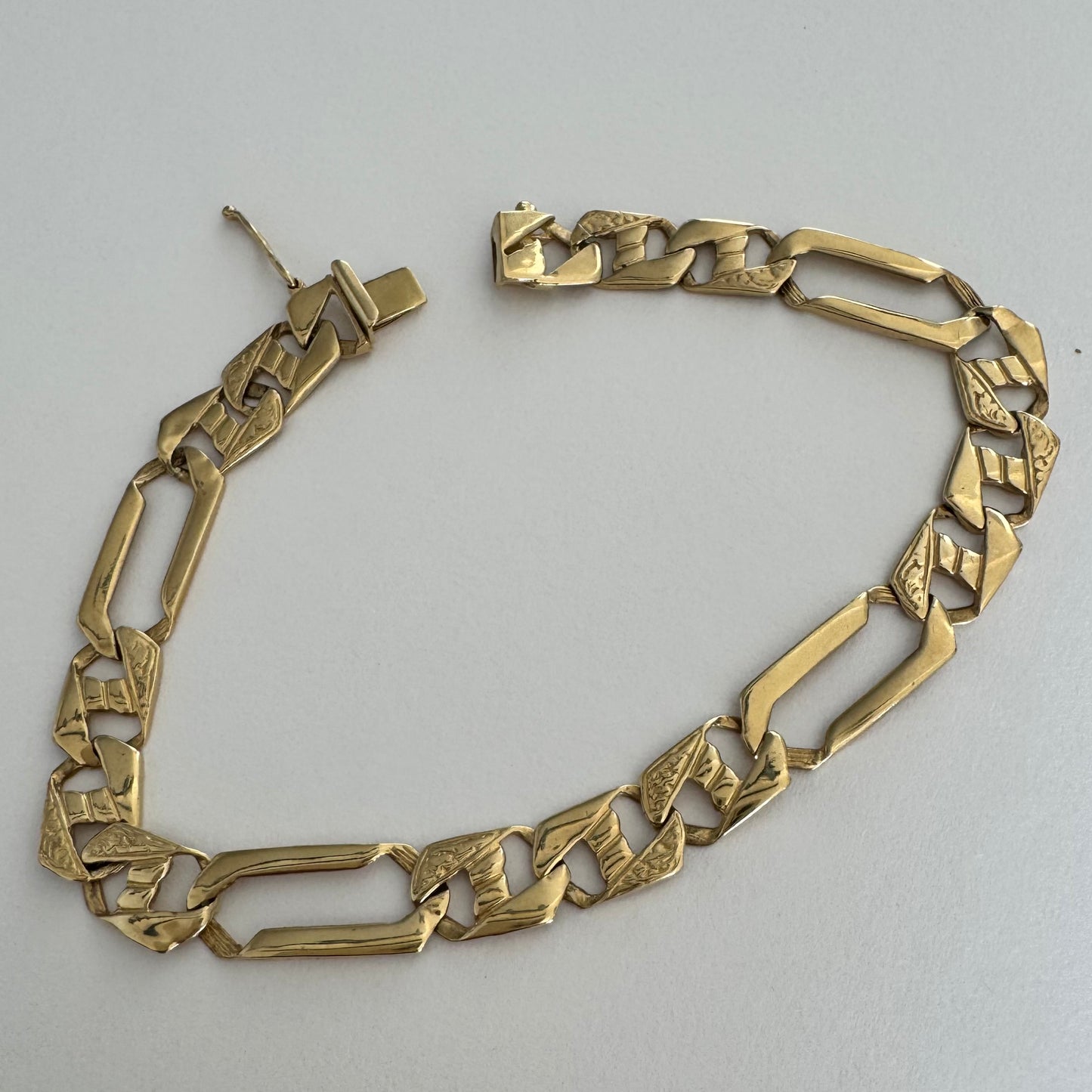 14K gold bracelet with a modern, distinctive link design