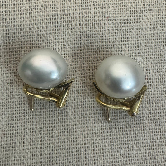 14K gold stud earrings set with large & luminous white Pearls.