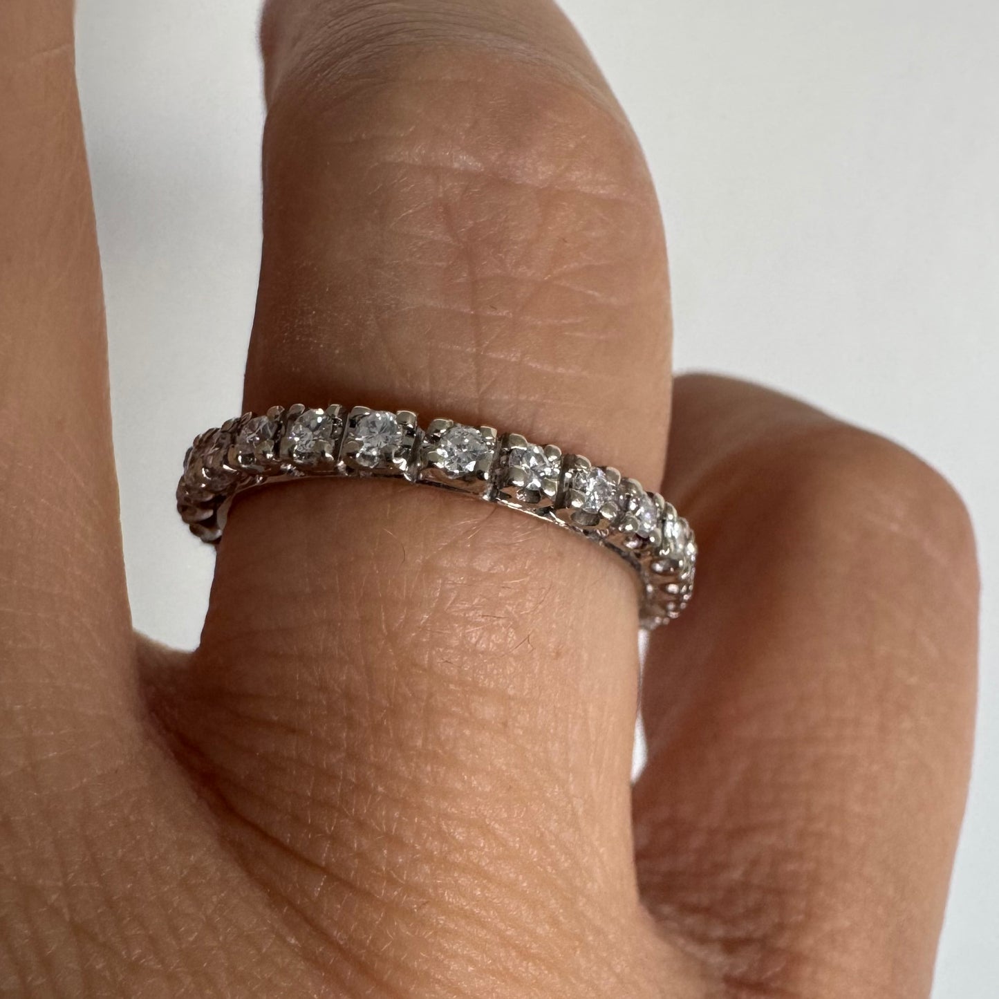 Classic 14K gold eternity ring set with a full circle of sparkling Diamonds