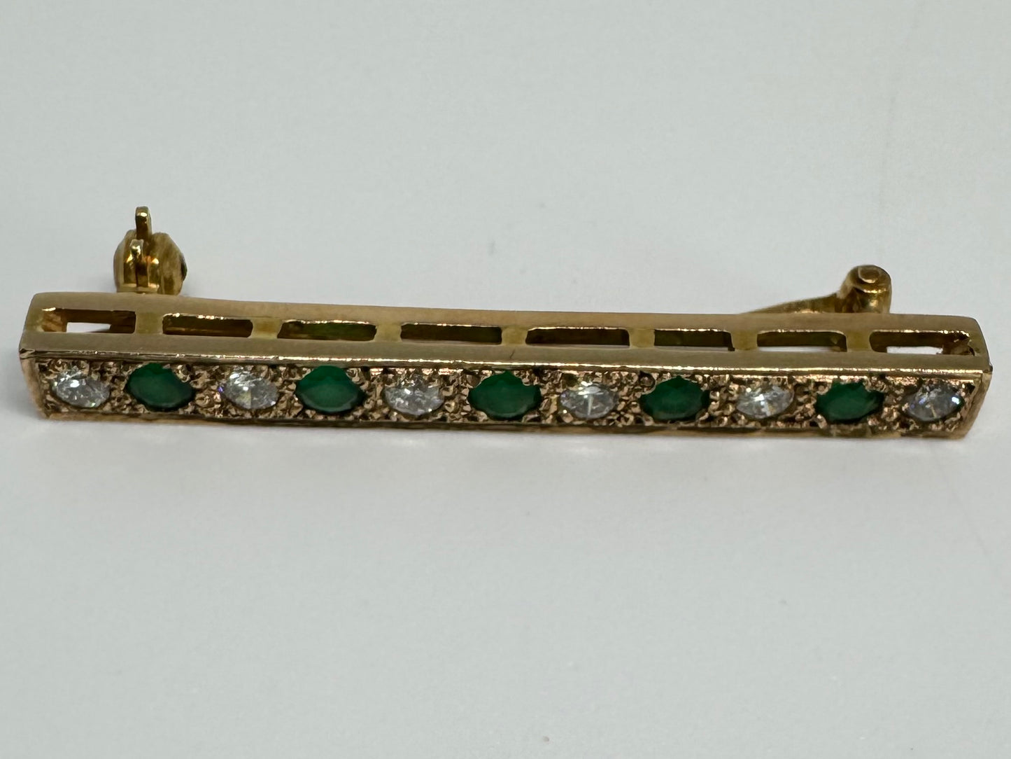 14K gold pin set with Emerald & Diamonds