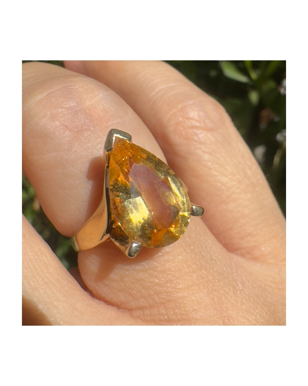 14K gold ring set with a large pear-shaped Citrine