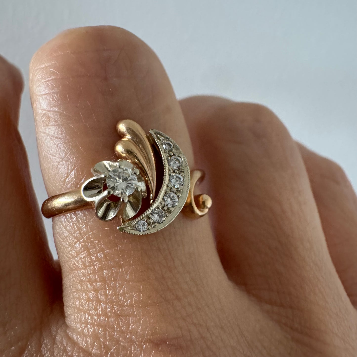 14K gold ring with a delicate moon and star motif set with Diamonds