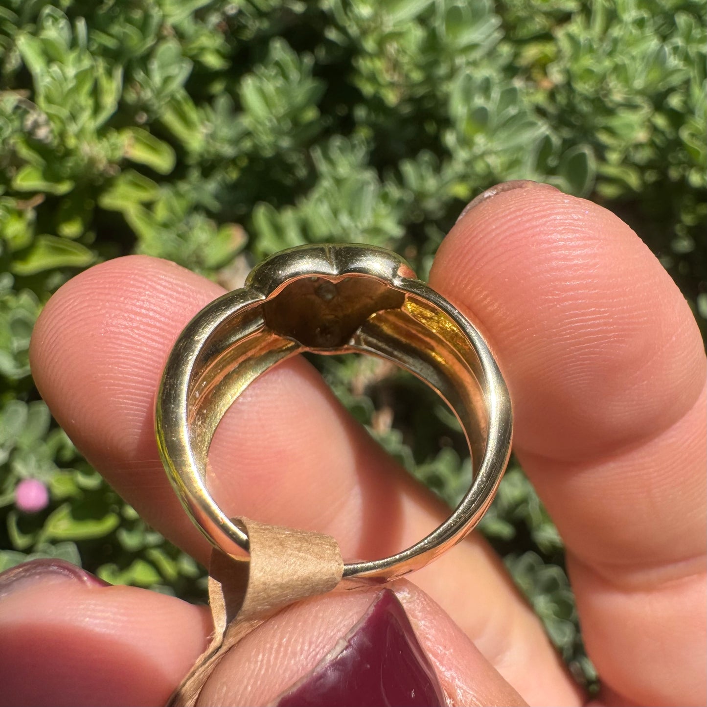 18K gold ring featuring a bold heart design, set with sparkling Diamonds in the center.