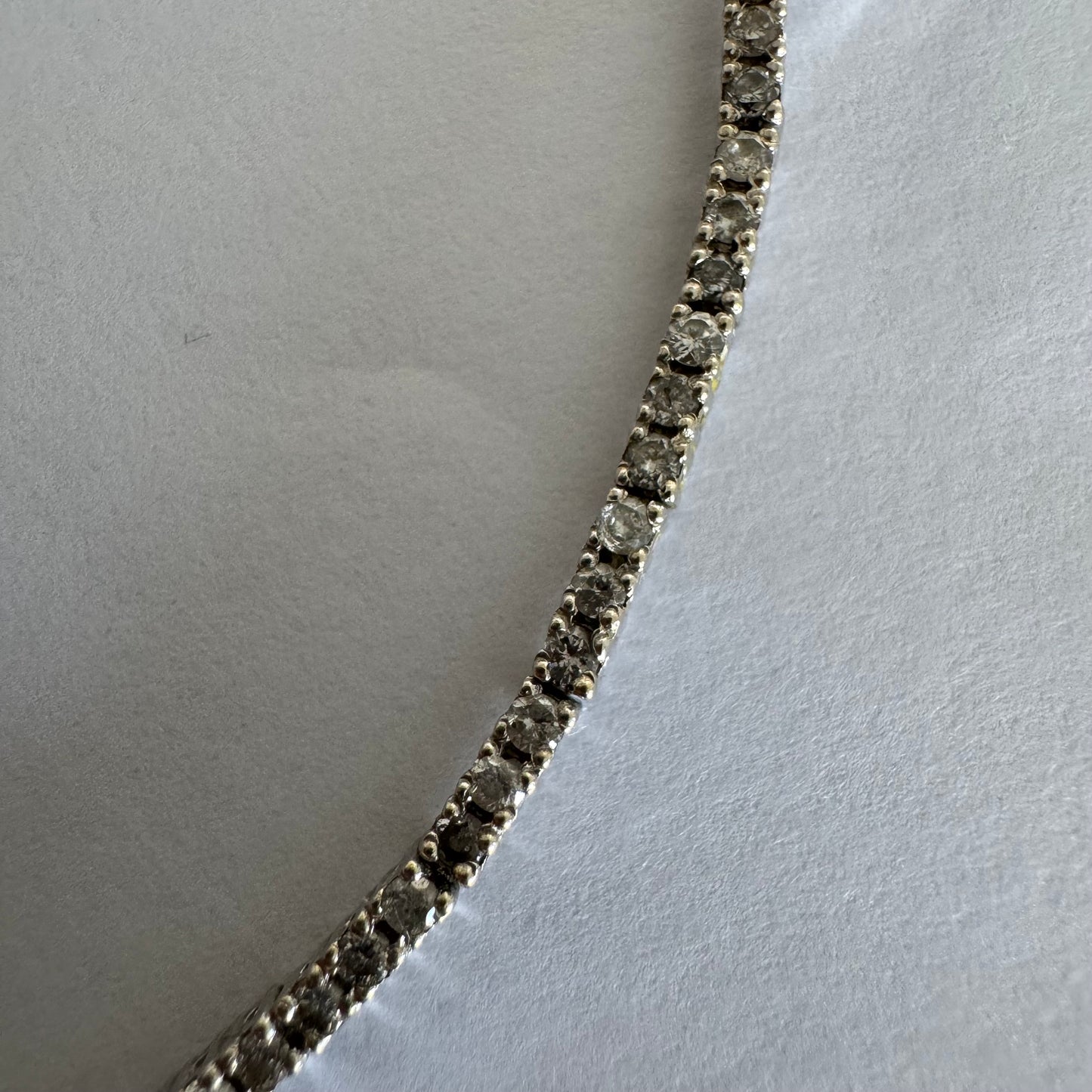 14K gold diamond bracelet with a sleek & elegant design.