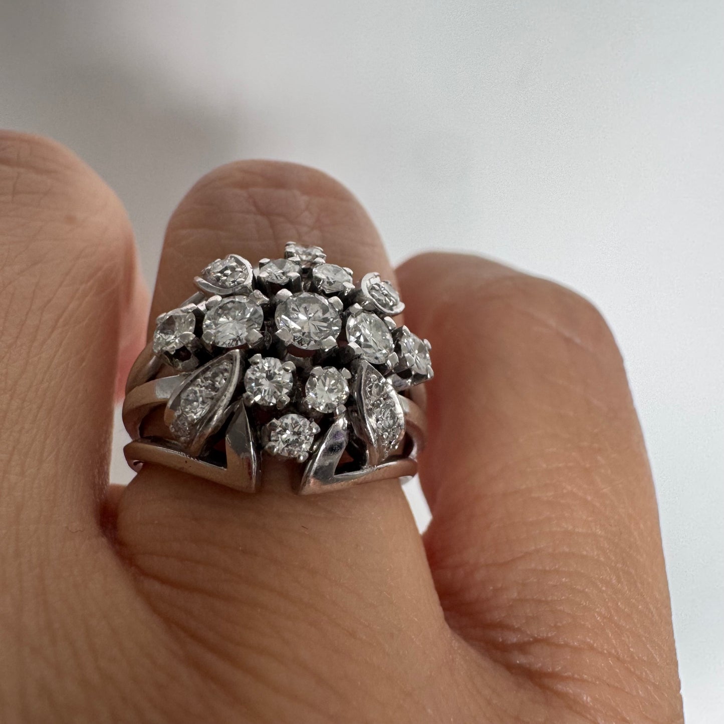 Platinum ring set with Diamonds in a bold, multi-layered floral design.