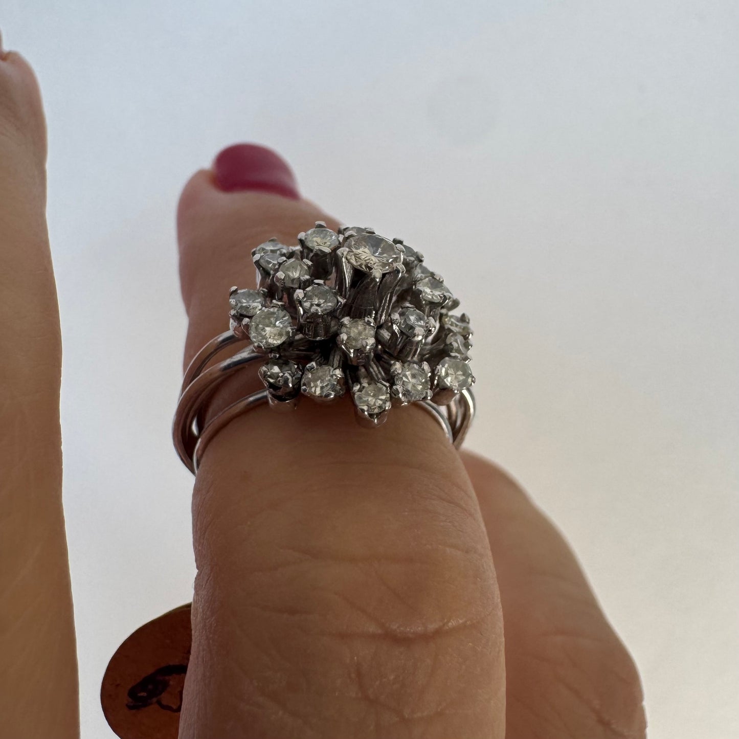 14K gold ring set with a cluster of sparkling Diamonds in a rich floral-inspired design.