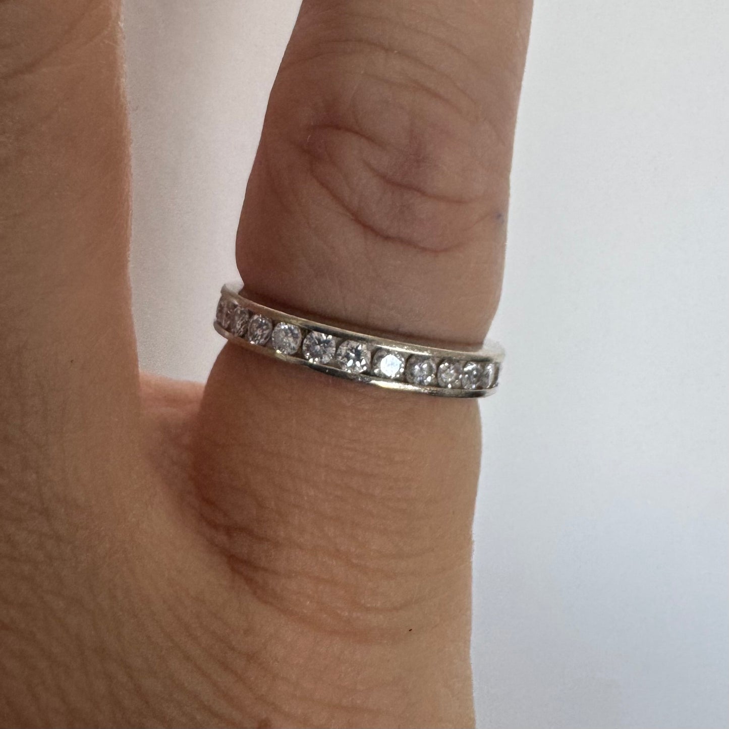 14K white gold eternity ring set with a row of sparkling Diamonds