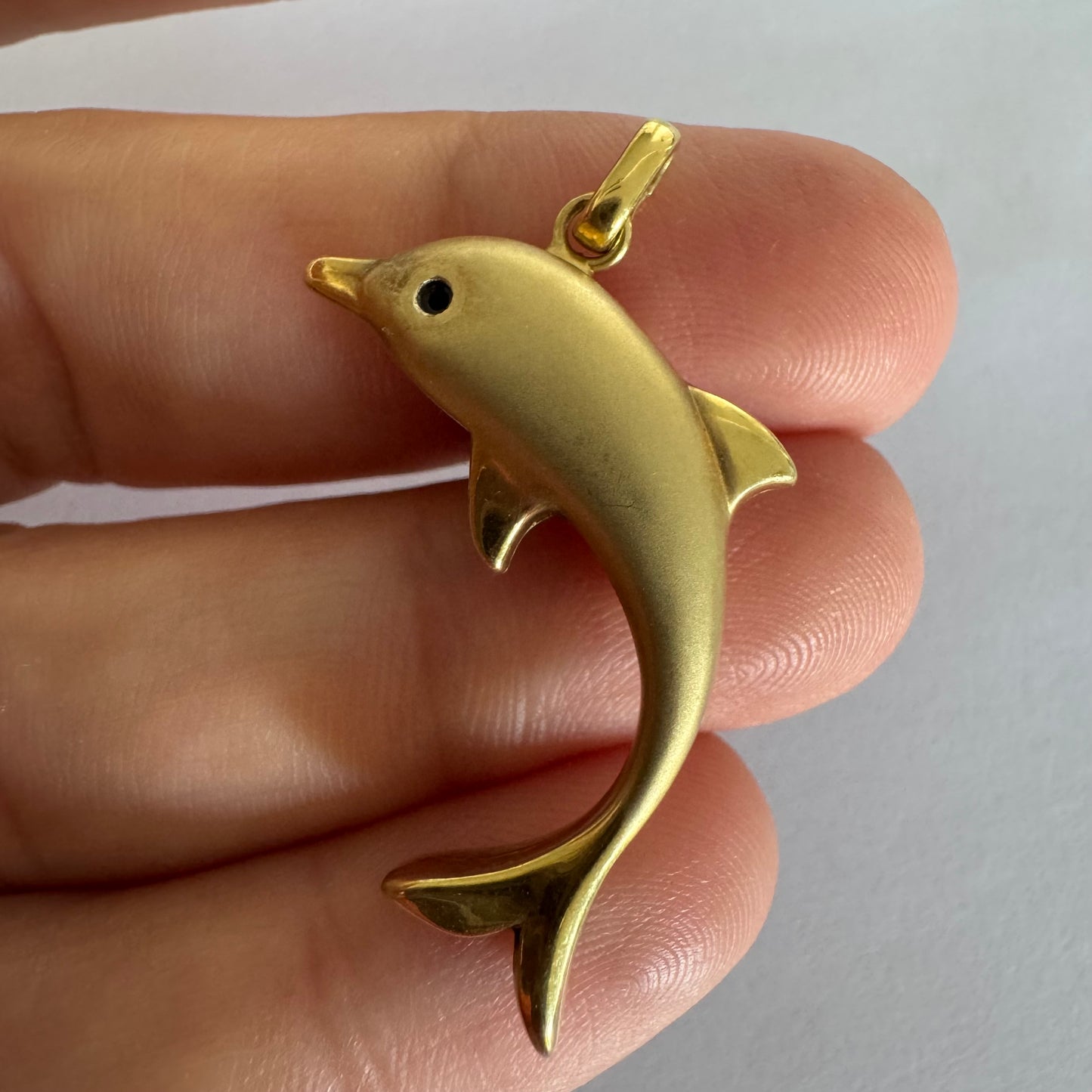 14K gold dolphin pendant with a smooth & polished finish.
