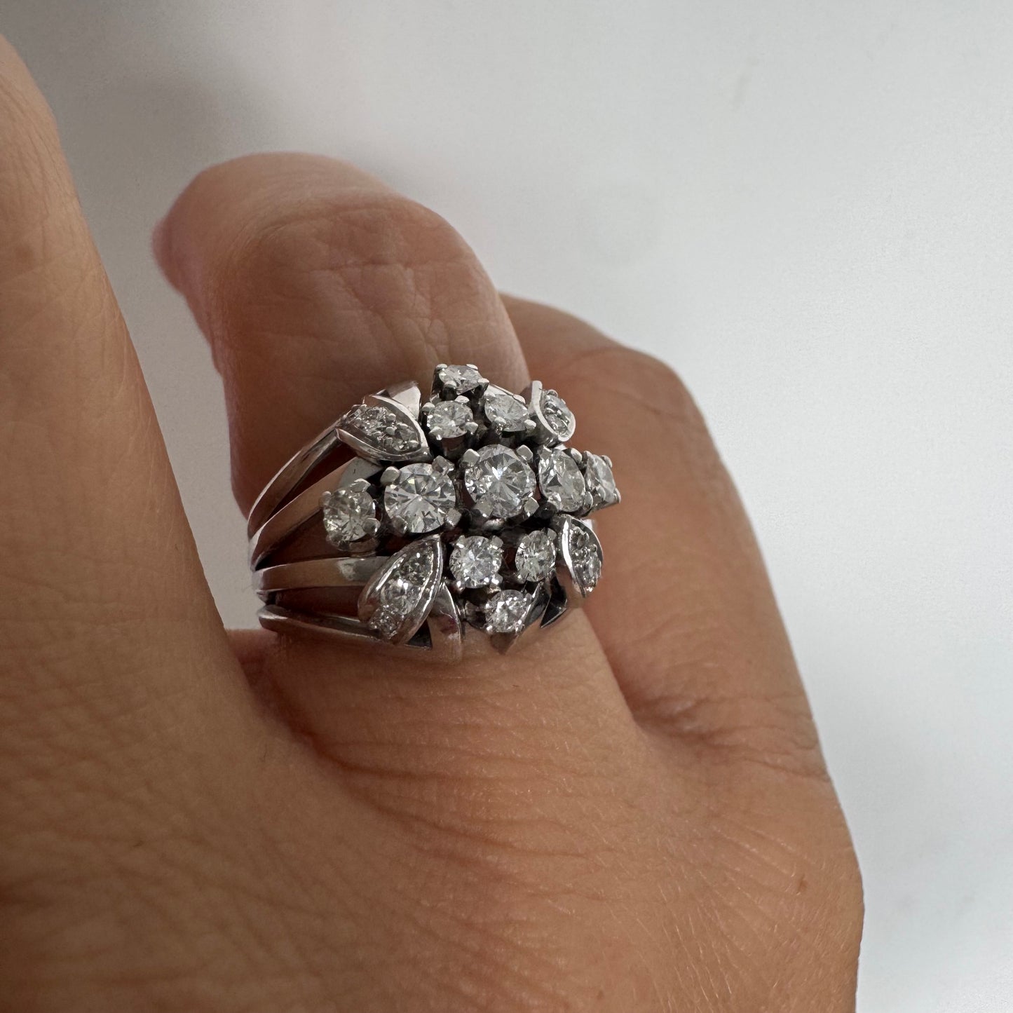 Platinum ring set with Diamonds in a bold, multi-layered floral design.