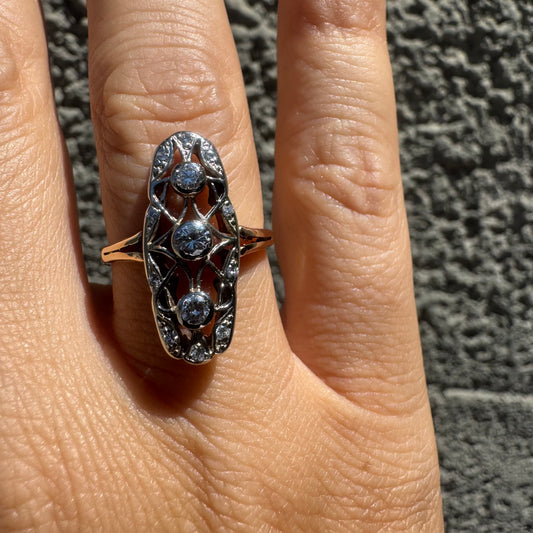 14K gold ring set with diamonds in an elongated openwork design