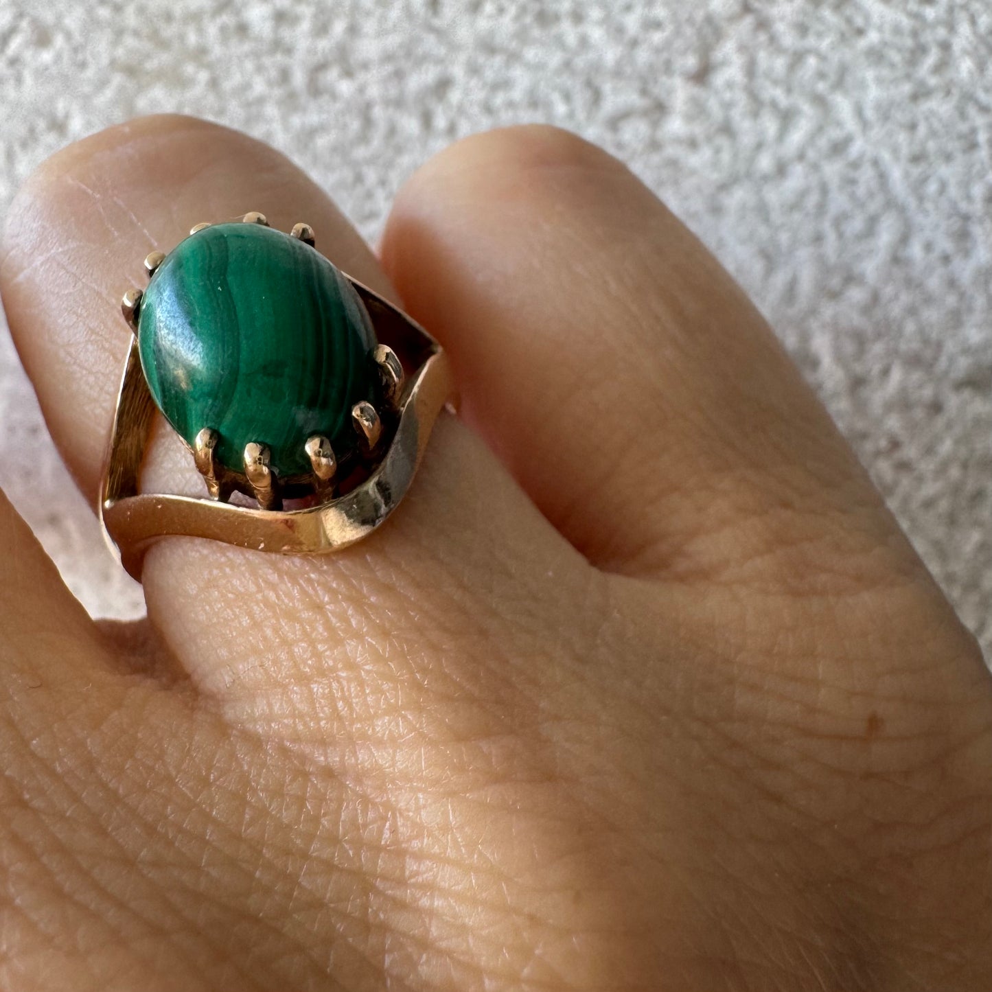 14K gold ring set with a polished Malachite cabochon