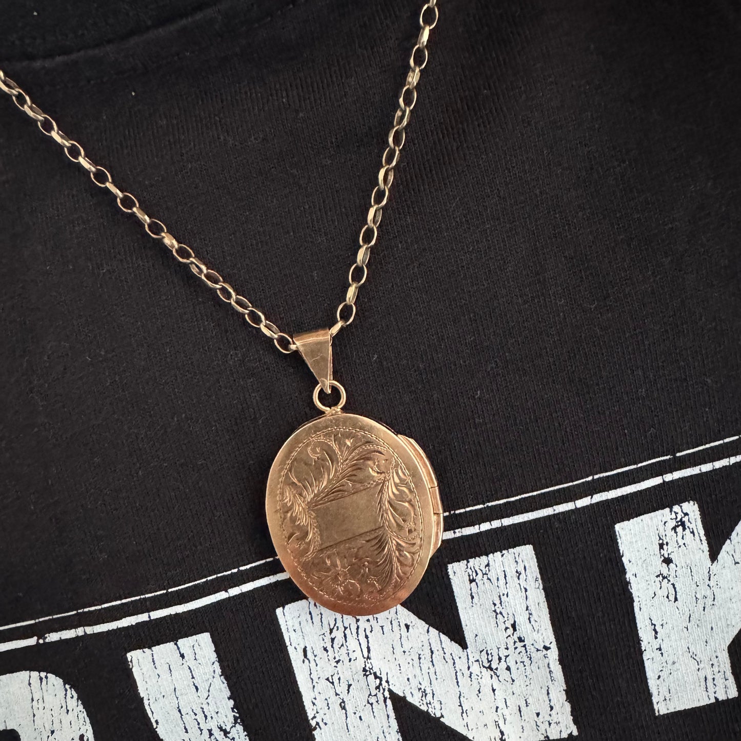 14K gold oval locket pendant delicately hand-engraved with floral motifs