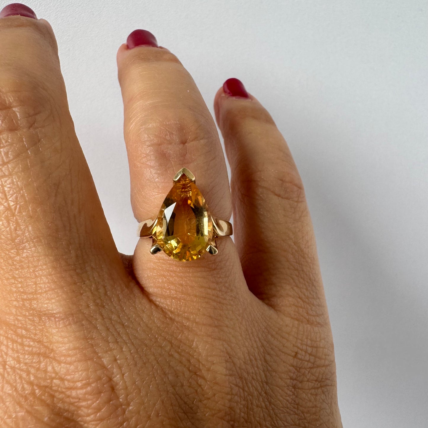 14K gold ring set with a large pear-shaped Citrine