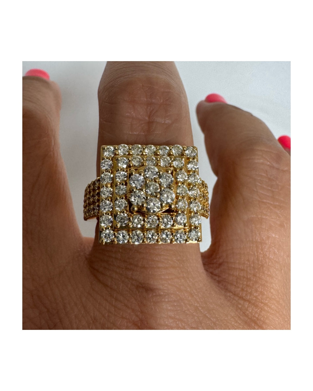 10K gold ring featuring a bold geometric design beautifully set with sparkling Diamonds
