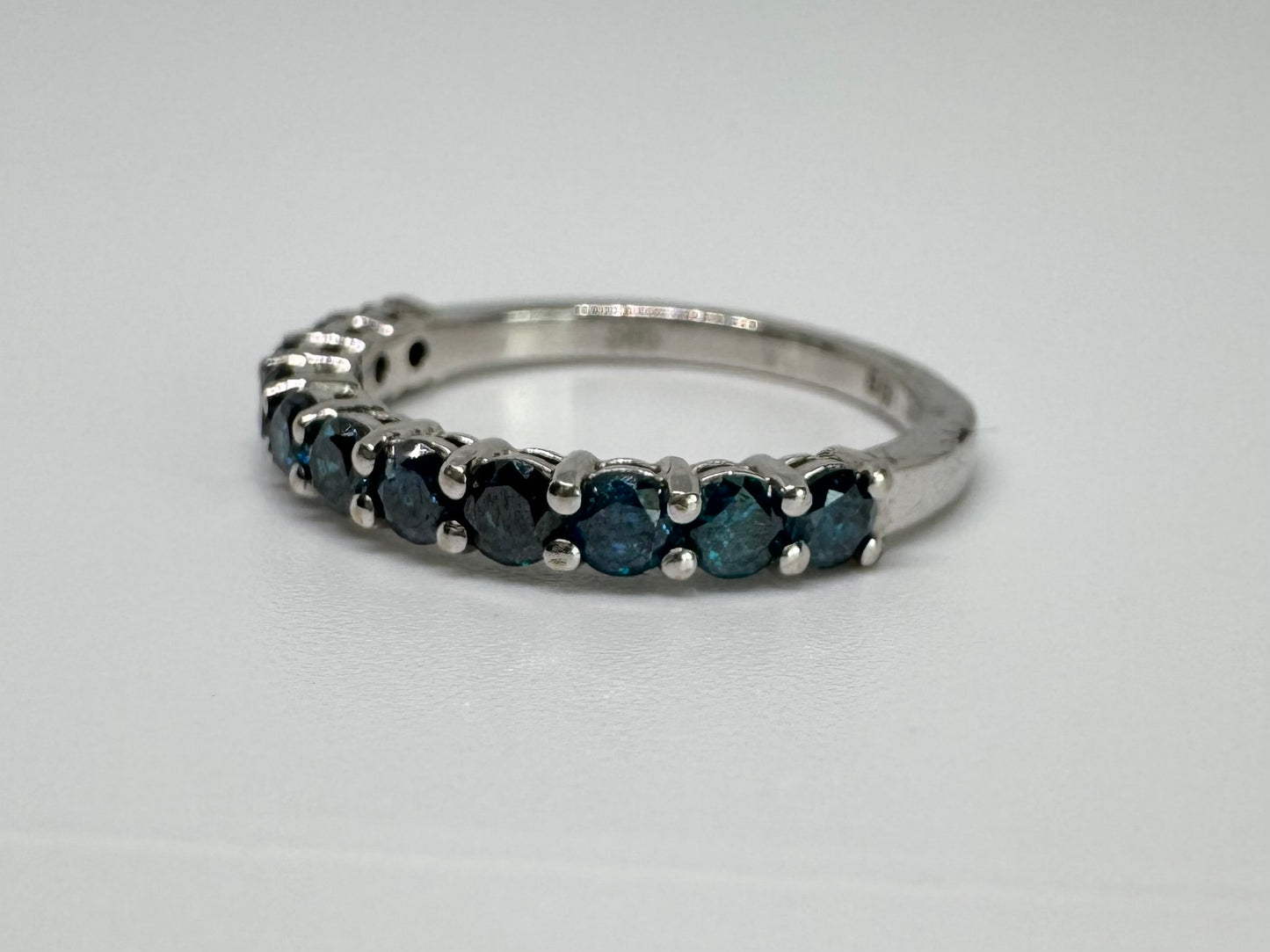 14K gold ring set with Blue Diamonds