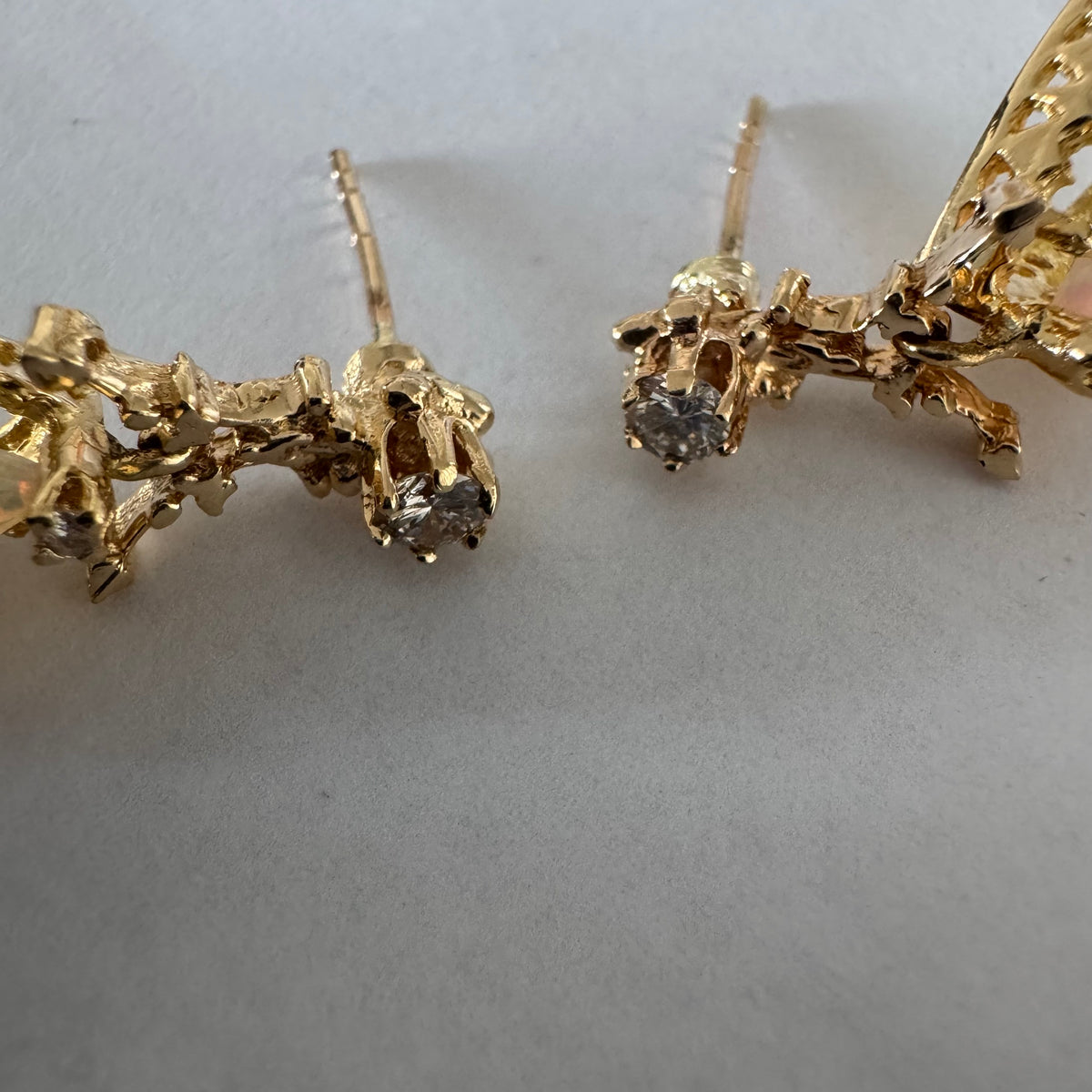 14K gold drop earrings set with pear-shaped Opals and Diamonds.
