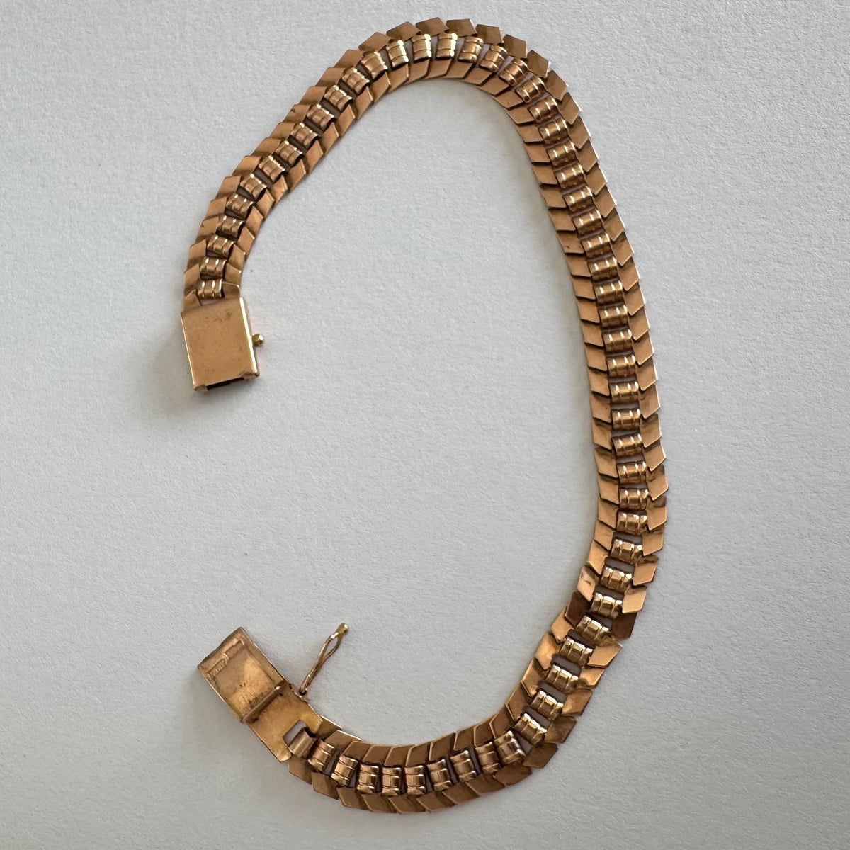 14K gold bracelet with a bold, flexible link design and a secure box clasp.