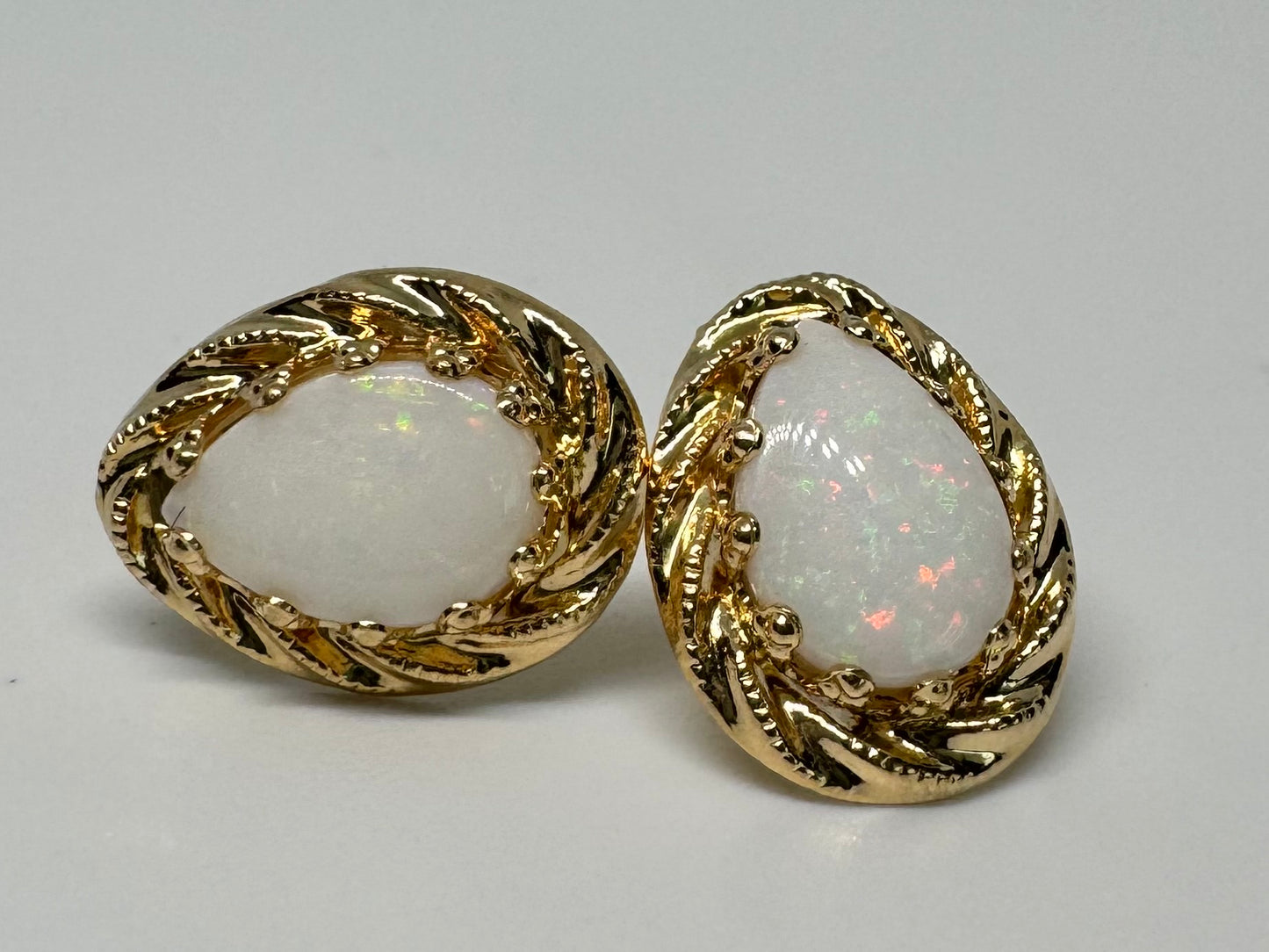 10K gold stud earrings set with Opal