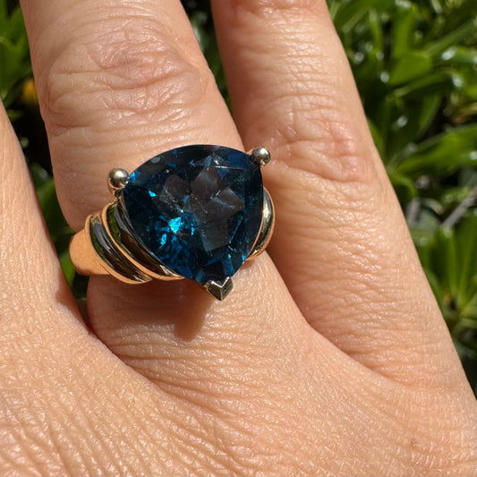 10K gold ring set with unique trillion-style cut Blue Topaz
