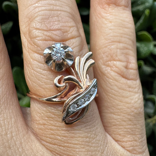 14K gold ring set with Diamonds with a romantic floral-inspired design.
